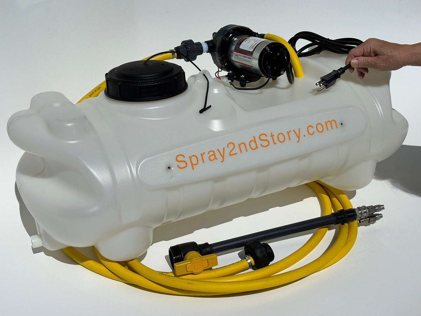 White spray tank with black & silver pump, black spray wand, and yellow hose with spray2ndstorycom branding
