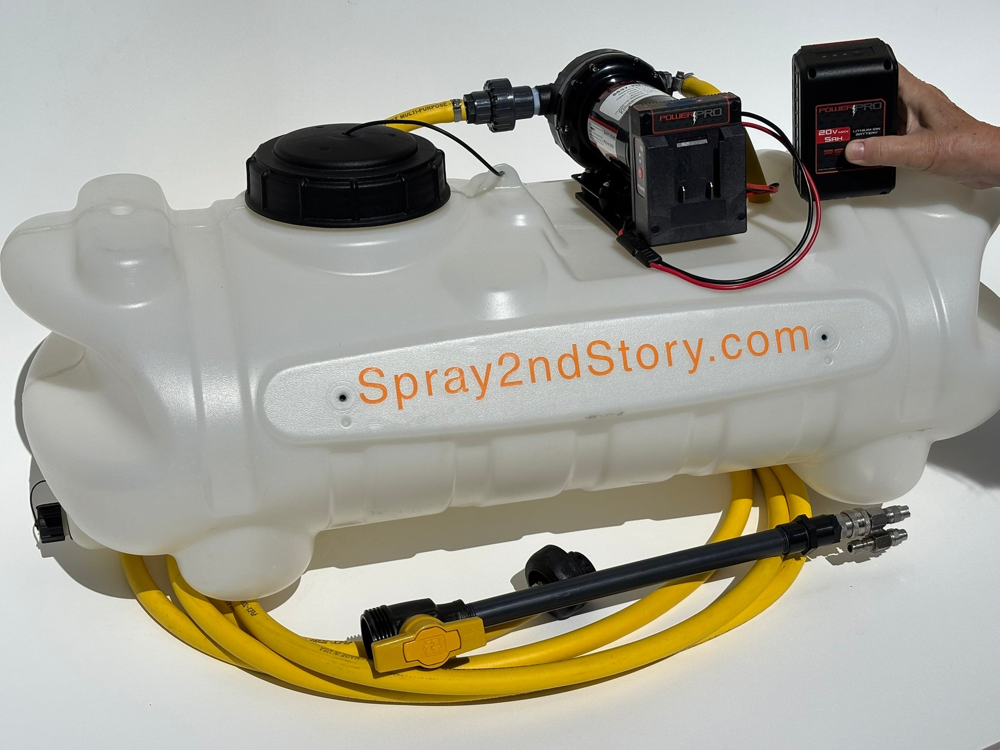 White spray tank with black pump, black battery, black spray wand, and yellow hose, featuring 'Spray2ndStory.com' branding.